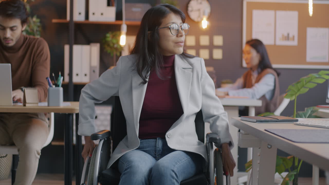 Businesswoman in Wheelchair in Modern Office