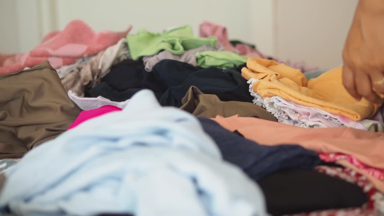Pile of clothes on a bed