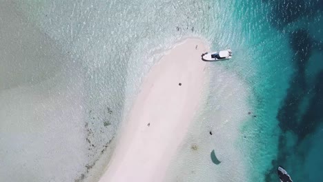 ZENITH-SHOT-KITESURF-in-LOS-ROQUES,-turn-over-sand-bank-with-turquoise-sea,-aerial-shor