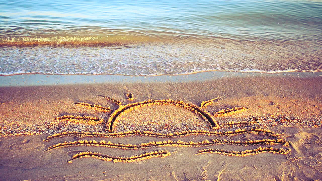 Sun drawing on the beach. Beach and drawing