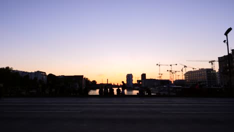 silhouetted berlin cityscape at sunset