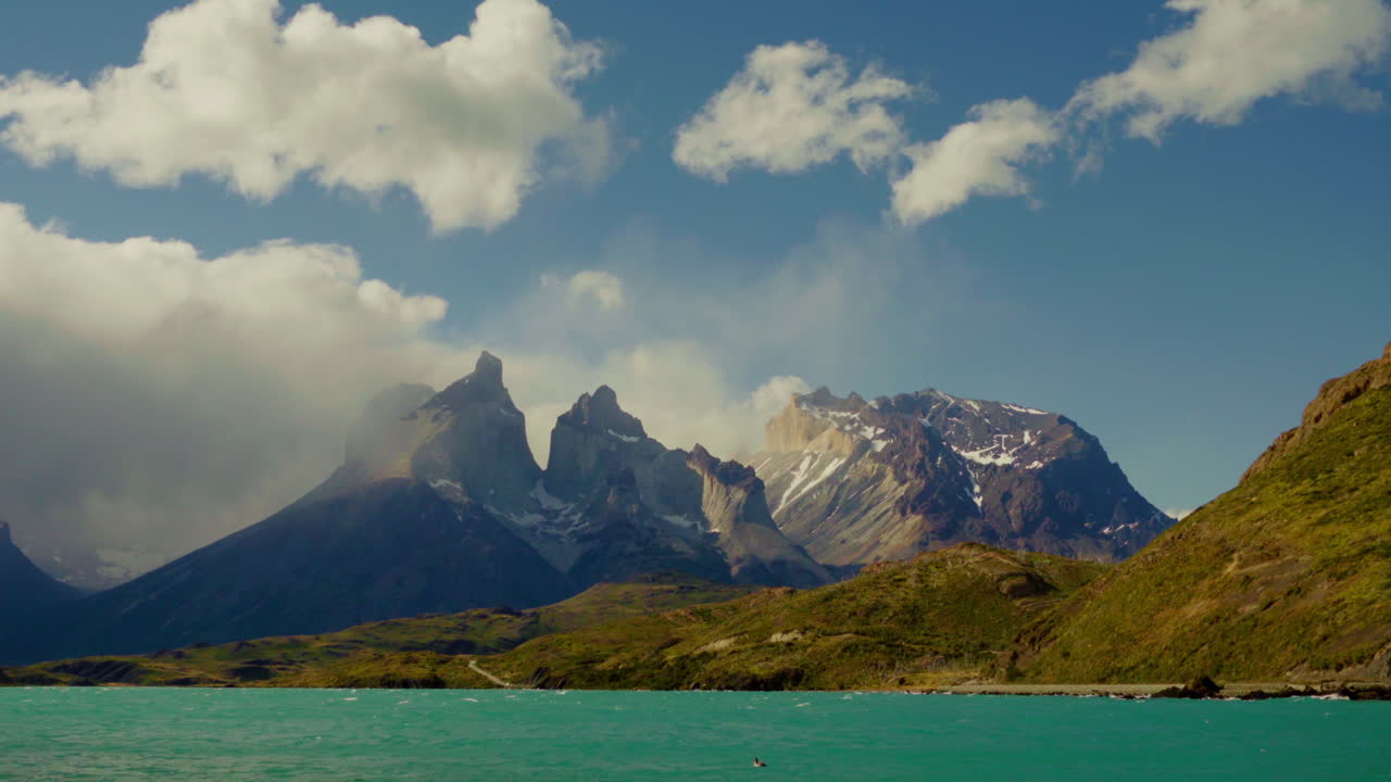 Scenic Static Wide Shot of Majestic "Los Cuernos" Mountain in Patagonia with Blue Lake in Foreground