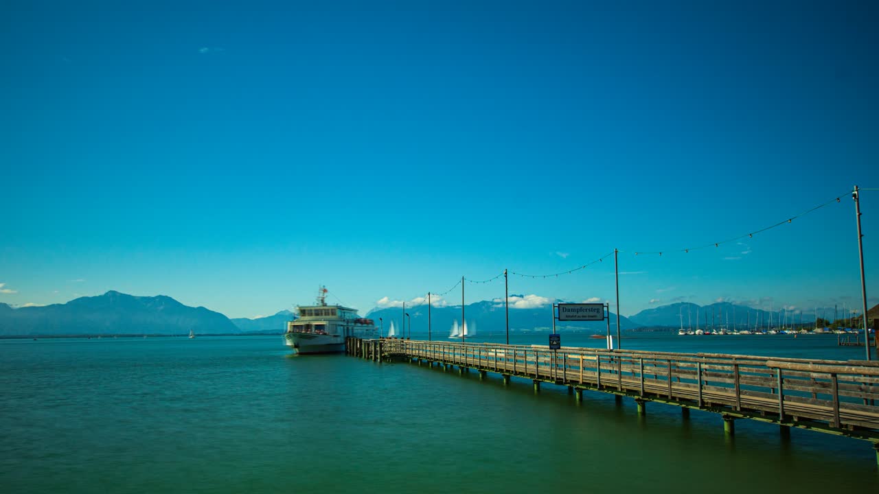Experience the Cologne Cathedral and Hohenzollern Bridge illuminated at night. This footage showcases the stunning night-time glow of the cathedral's gothic spires and the bridge's vibrant lights.