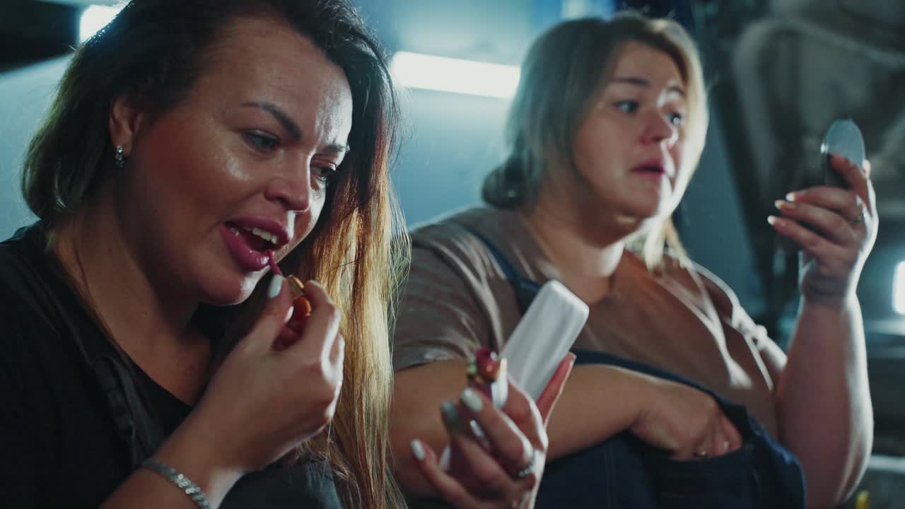 Two women getting ready with makeup
