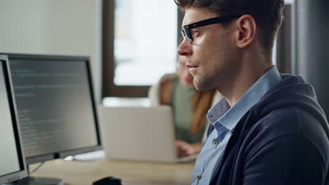 Closeup-developer-hands-coding-in-office.-Focused-it-man-programming-software