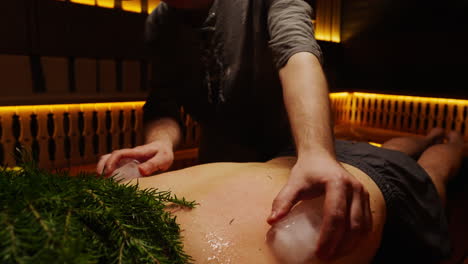 ice therapy back massage in a sauna
