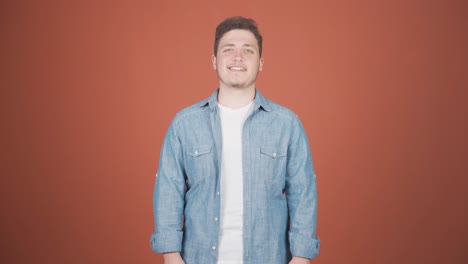 Man-smiling-at-camera