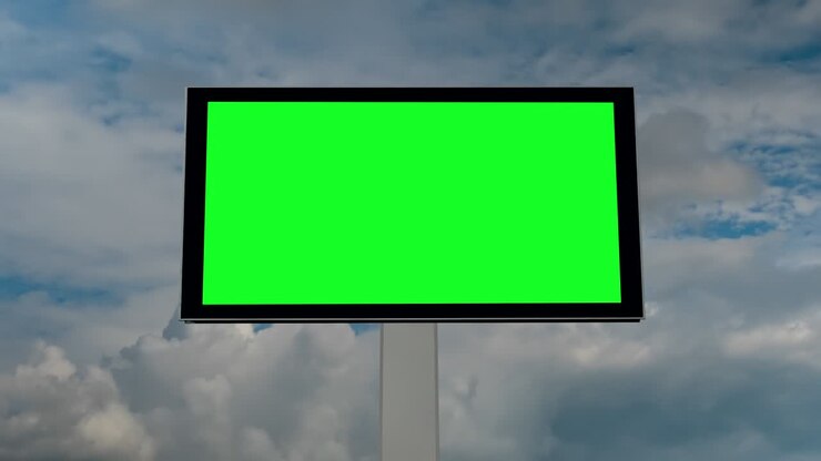Timelapse - blank green billboard and moving white clouds agains blue sky