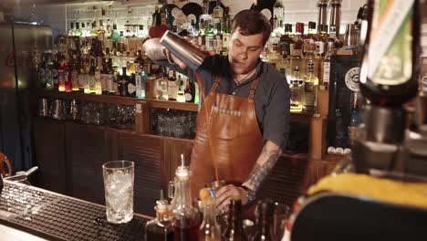 bartender preparing cocktails at a bar