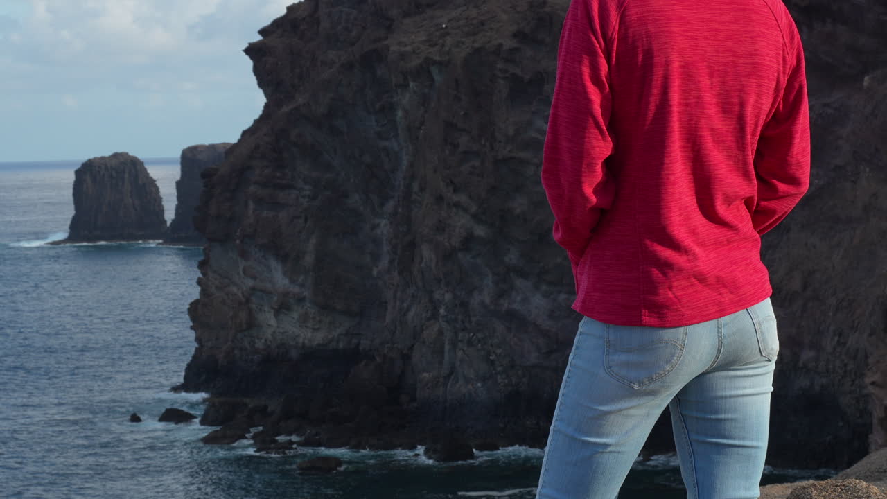 Traveler enjoying scenic coastal landscape in Gran Canaria. Roque Partido.