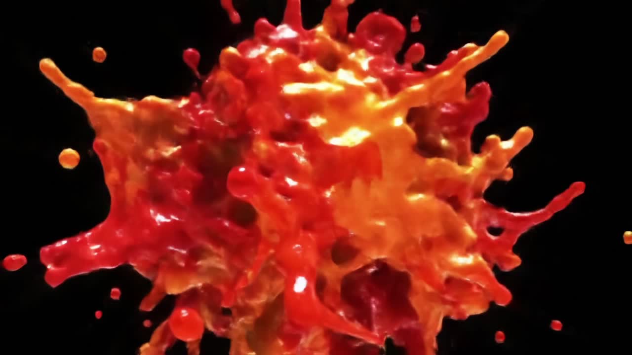 Dynamic Explosion of Colorful Liquid Splashes Captured in Stunning Detail, Highlighting the Energy and Fluidity of Red and Orange Hues Against a Dark Background