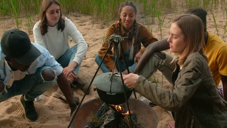 friends camping and cooking food