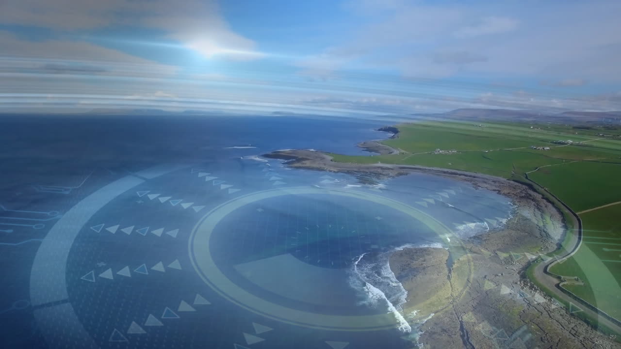 Hovering circular digital interface overlay mapping curved coastal headland meeting deep blue sea