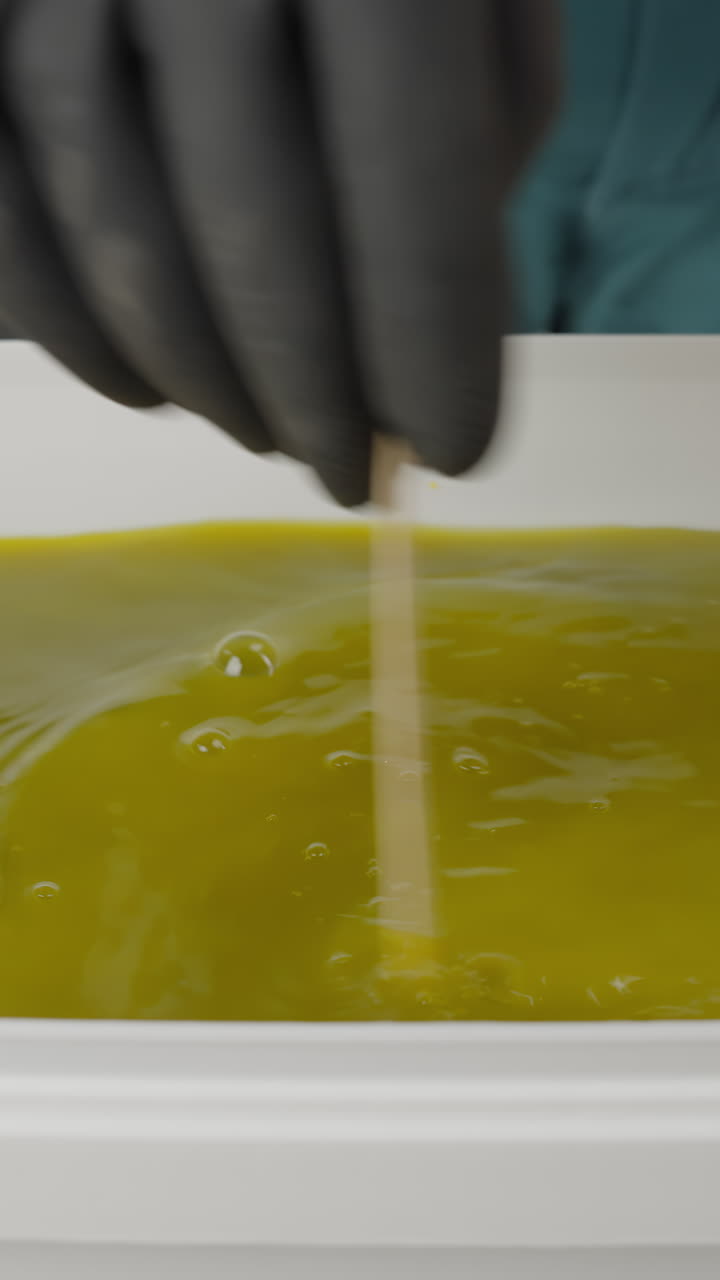 Processing Green Liquid in a White Container