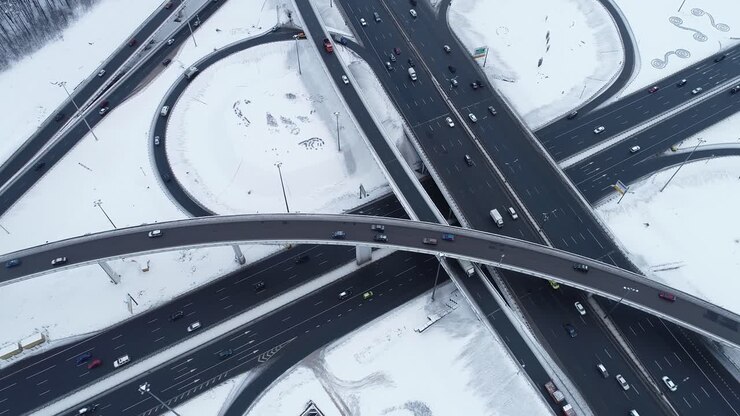 Aerial view of a freeway intersection Snow-covered in winter.