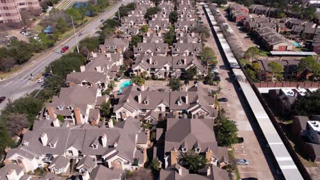 Aerial-View-of-Modern-American-Residential-Community-Complex,-Homes-and-Street-Traffic