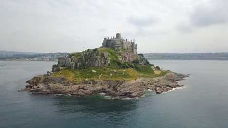 Aerial:-Saint-Michael's-Mount,-Cornwall-UK,-arc-shot-panoramic