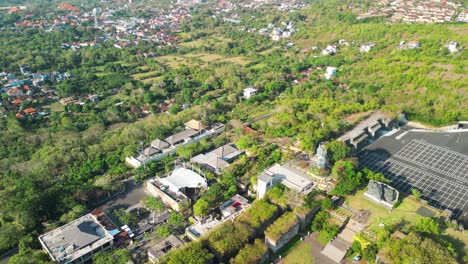 aerial during sunshine day over garuda wisnu kencana, an renowned cultural park located in bali, indonesia