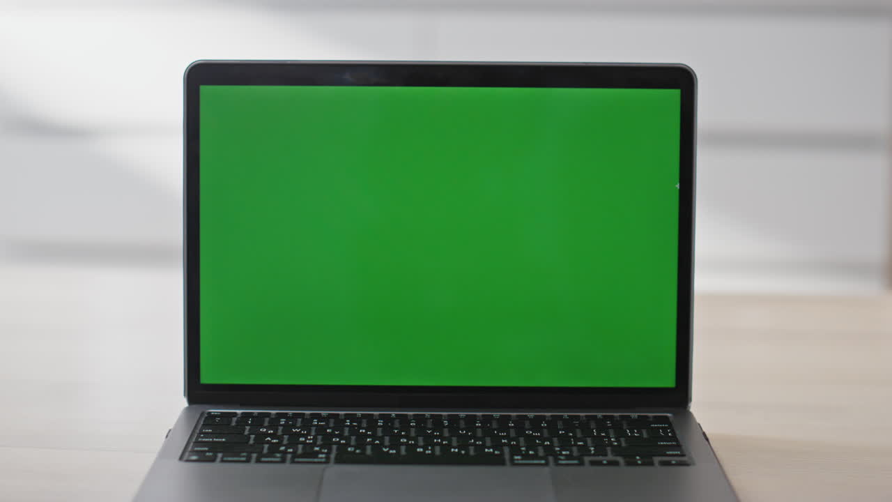 Empty chroma key laptop contemporary workplace closeup. Mockup display computer