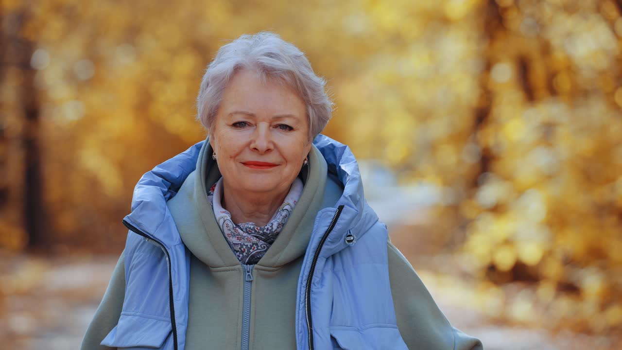 Happy Senior Woman Smiling in an Autumn Park