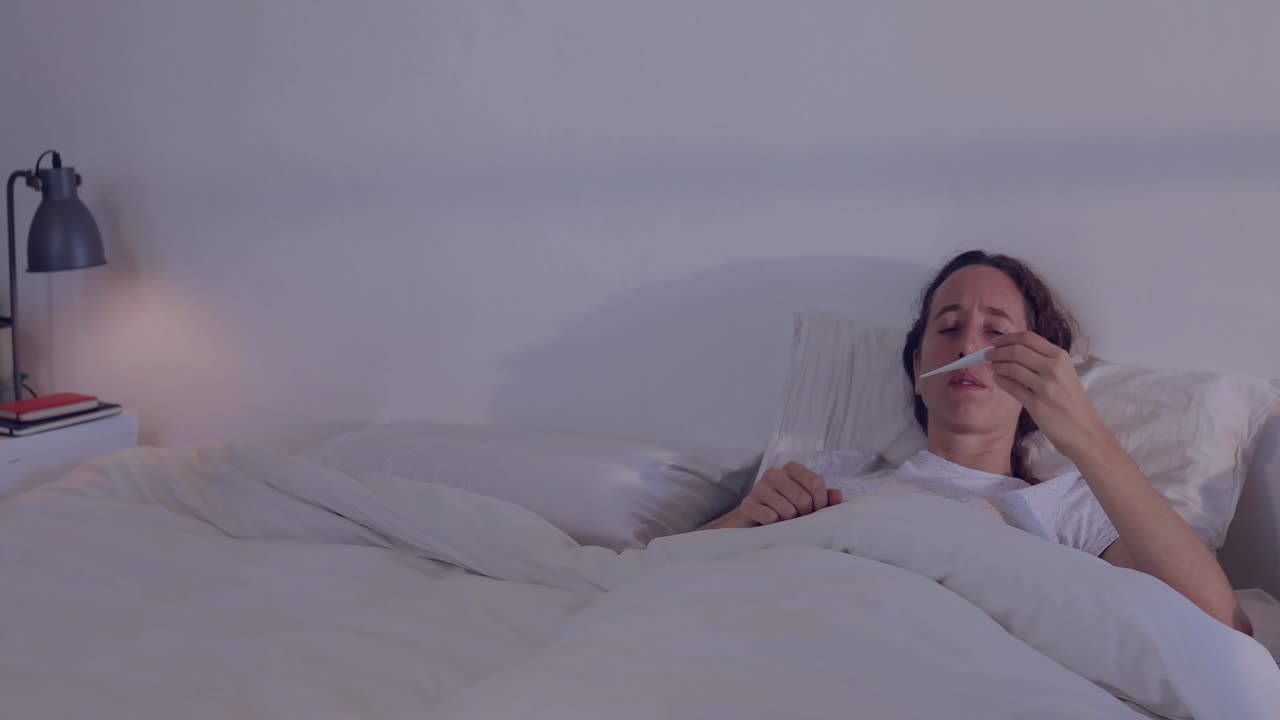 Woman waking and pulling thermometer checking fever while media notifications swirling