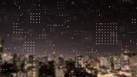 Dots-forming-square-against-night-cityscape