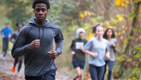 group of athletes running outdoors