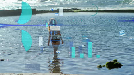 person walking in water with data visualization animation over ocean scene