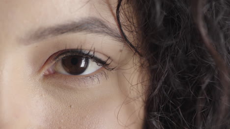 close-up-beautiful-woman-eye-looking-at-camera-iris-reflection-natural-human-beauty