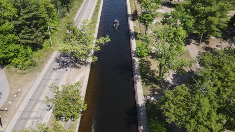 narrow canal for small boats to hop lakes in michigan, aerial view