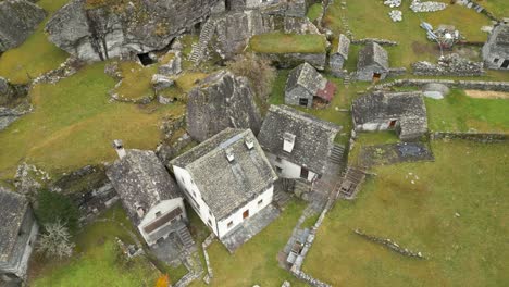 overhead drone shot strafing to the right, above the village of cavergno, in the district of vallemaggia, situated near the border of italy in the canton of ticino, switzerland