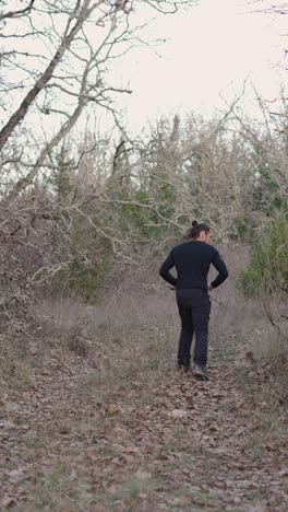 a man walking in a forest