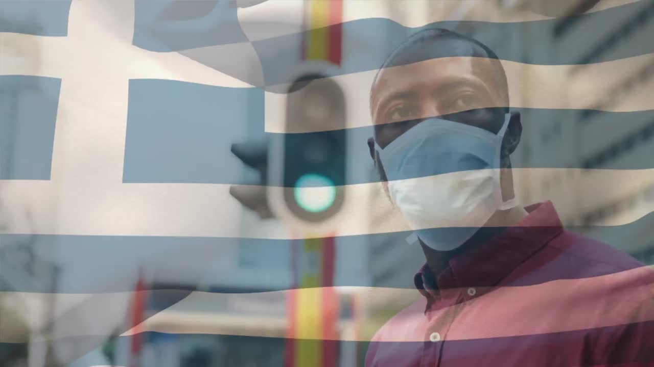 코로나 19 대유행 기간 동안 얼굴 마스크를 쓰고 있는 남자 위에 흔들리는 그리스 국기의 애니메이션