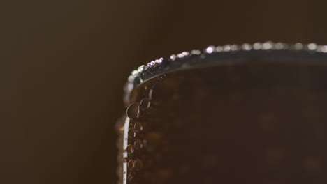 Close-Up-Backlit-Shot-Of-Condensation-Droplets-On-Revolving-Takeaway-Can-Of-Cold-Beer-Or-Soft-Drink-1