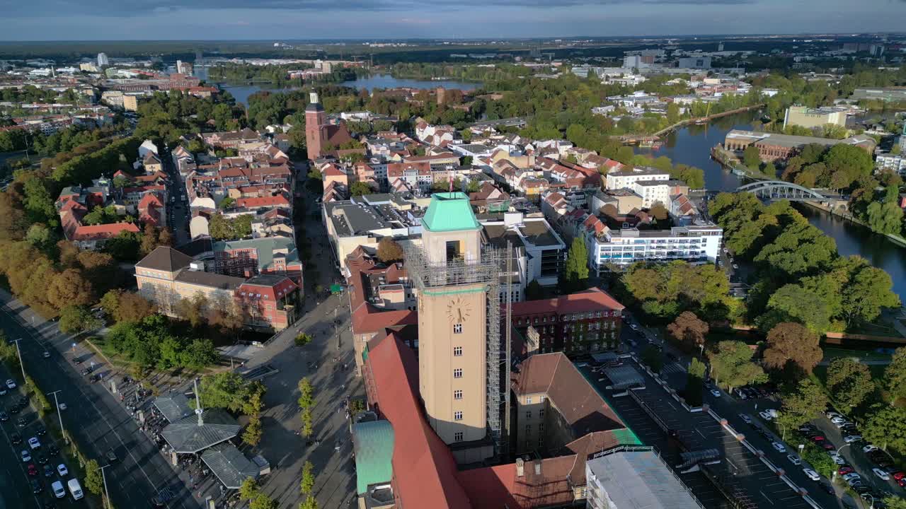 Aerial view showing Rathaus Spandau building, subway station, and public transportation in Berlin. Marvelous aerial view flight drone shot from above