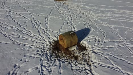 Haystack-on-the-farmer's-field-covered-with-snow-in-winter