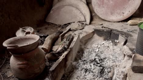 slow revealing shot of broken and smashed plates in a poverty-stricken house