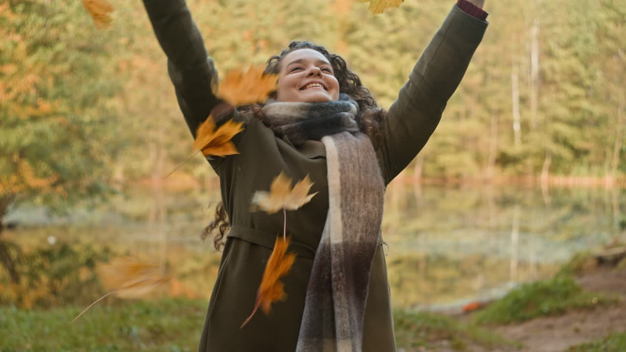 Woman enjoying autumn by the lake