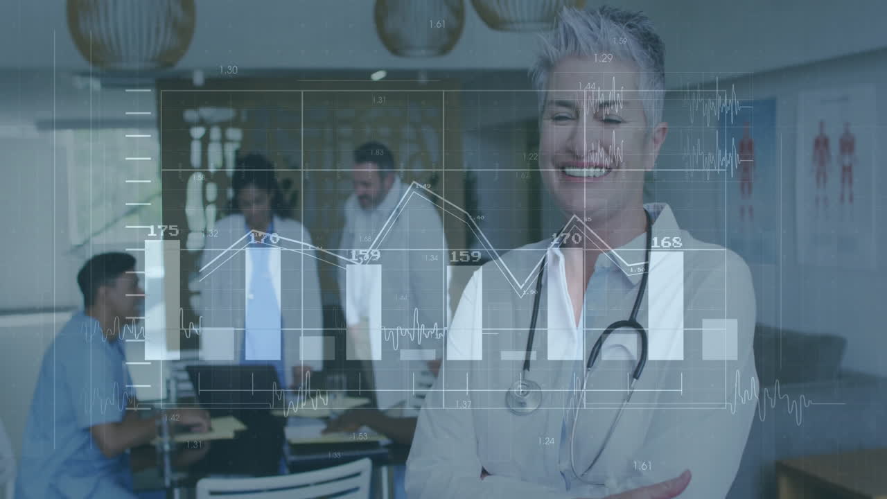 Senior woman doctor standing in clinic room, featuring animated medical charts over laptop display
