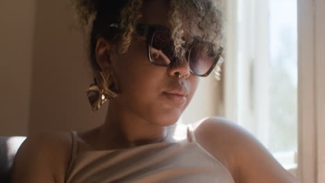 close-up view of fashionable african woman looking down