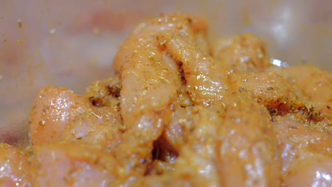 close up shot of marinated chicken with spices