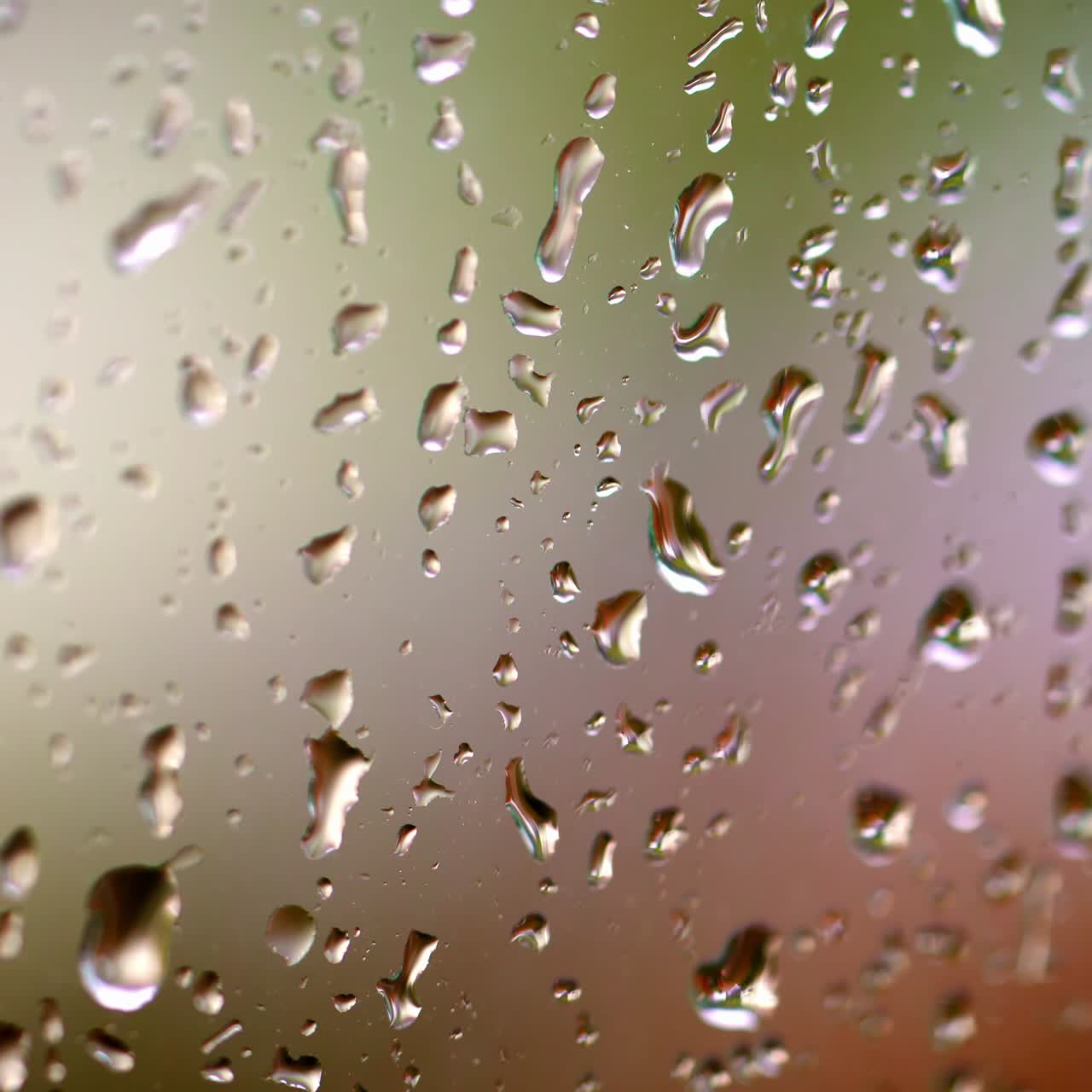 Drops on glass. Rain on glass window from indoors. Rain on glass. Raindrops of water on window background. Bad weather. Macro shot.