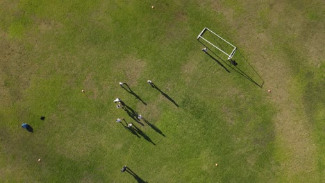 aerial top down view of players dribbling the football during championship match