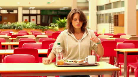 upset student eating lunch alone