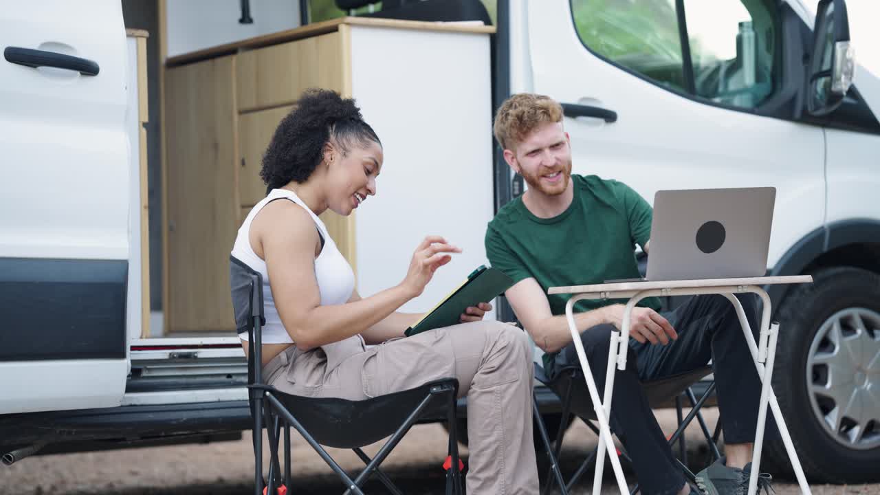 Couple Working Remotely from Their Campervan