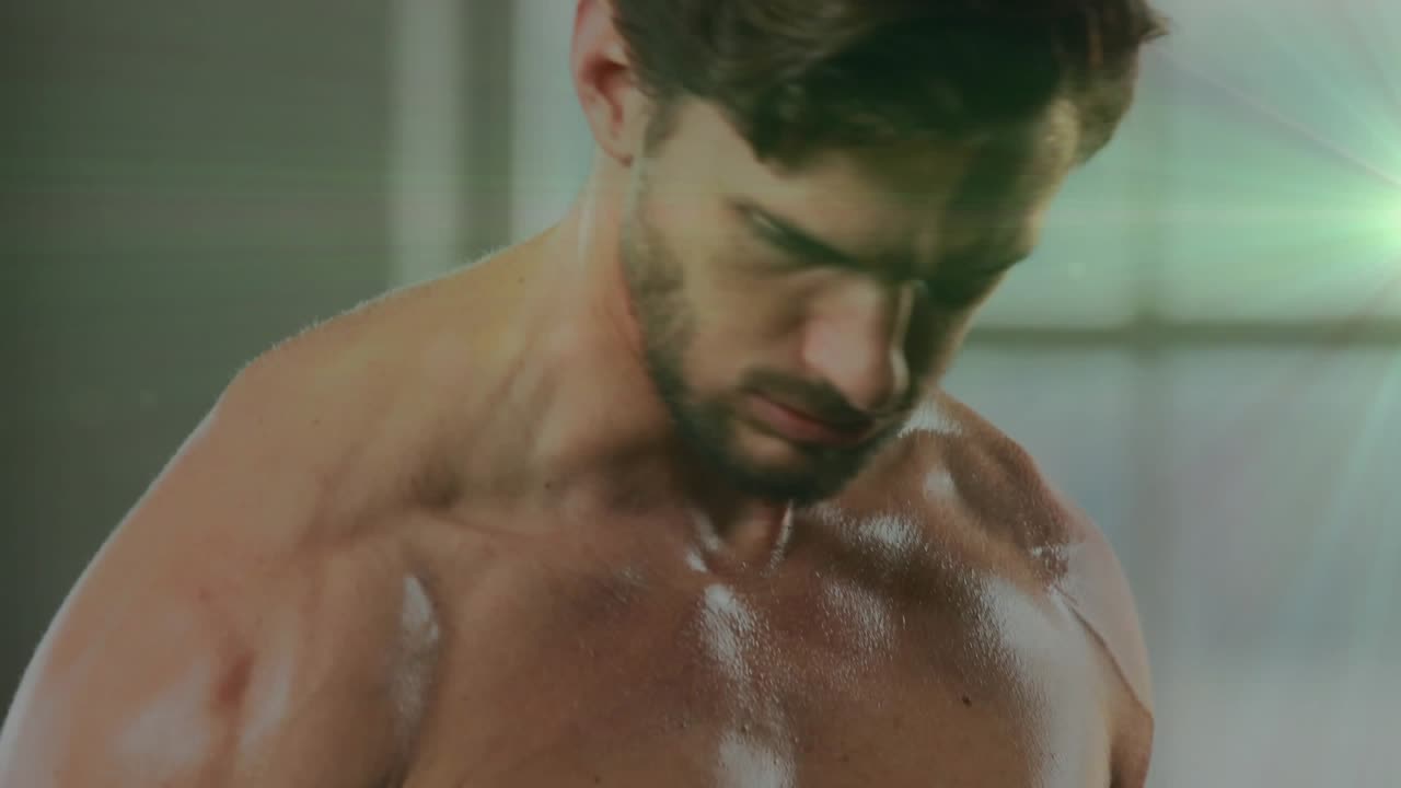 Man gripping hex dumbbell, performing bicep curls in gym, green flare highlighting muscle growth