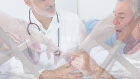 animación de un hombre caucásico mayor con un médico masculino biracial sobre una pareja mayor en la playa
