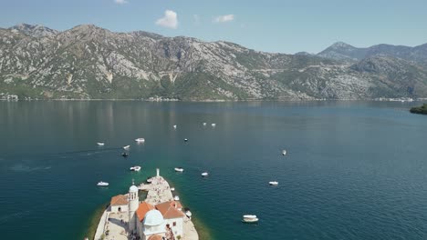 tour boats deliver people to our lady of the rocks, perast montenegro