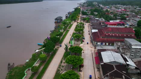 pucallpa, perù - city on the amazon river jungle rainforest - 4k high resolution - drone fly view shot from above