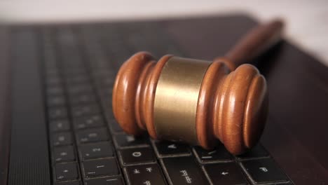 gavel on a laptop keyboard